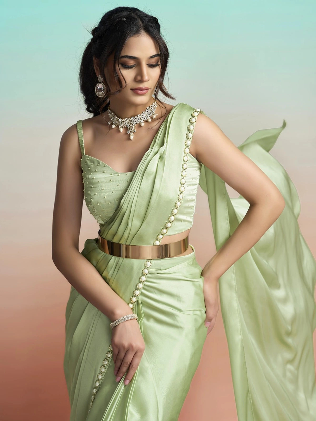 Tarani Padmika green satin silk saree upper body view with pearl blouse and drape