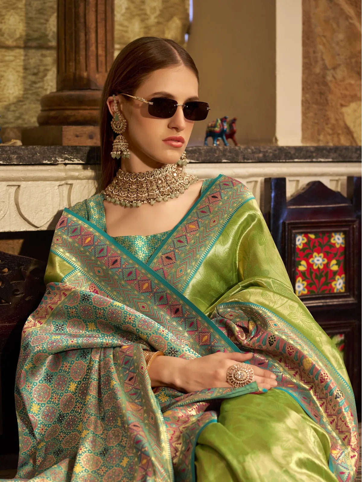 Tarani green tissue silk saree upper body view highlighting contrast blouse and necklace