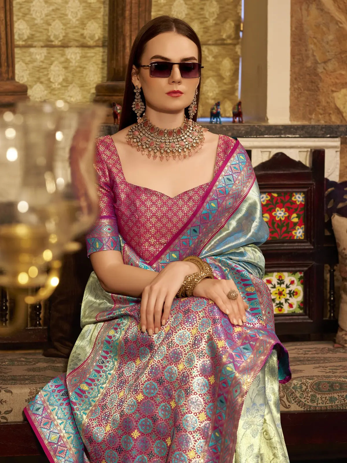 Tarani elegant green tissue silk saree upper body view with rich woven border and festive appeal