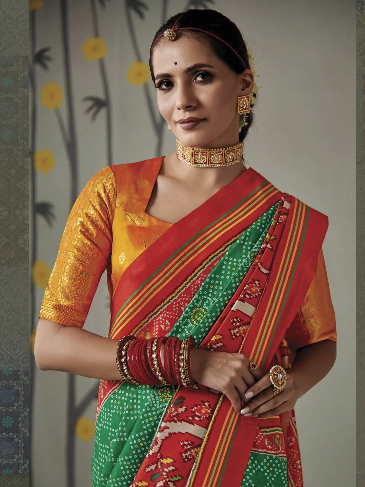Tarani Tusser silk saree green with Patola inspired pallu and golden blouse upper body view