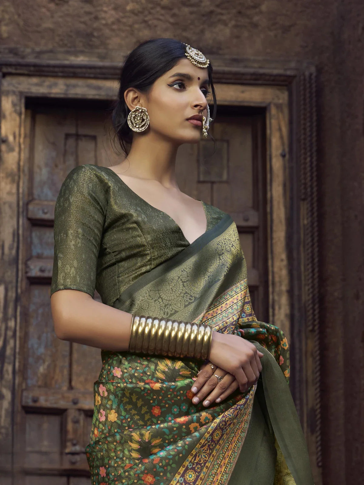 Tarani green silk saree upper body view with matching silk blouse and accessories
