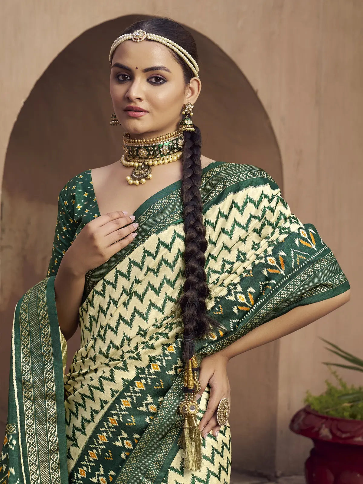 Tarani green silk saree upper body view showcasing blouse design with jewelry styling