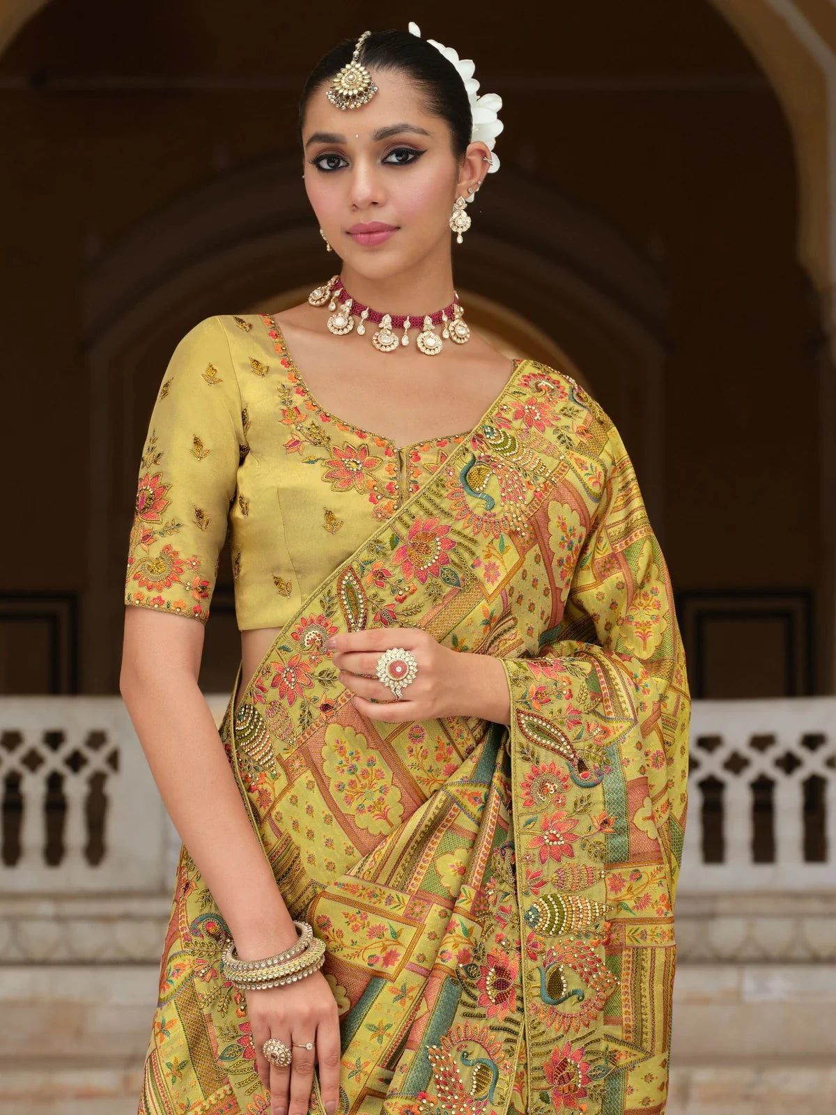 Tarani green saree close-up with zari embroidered blouse and elegant jewellery styling