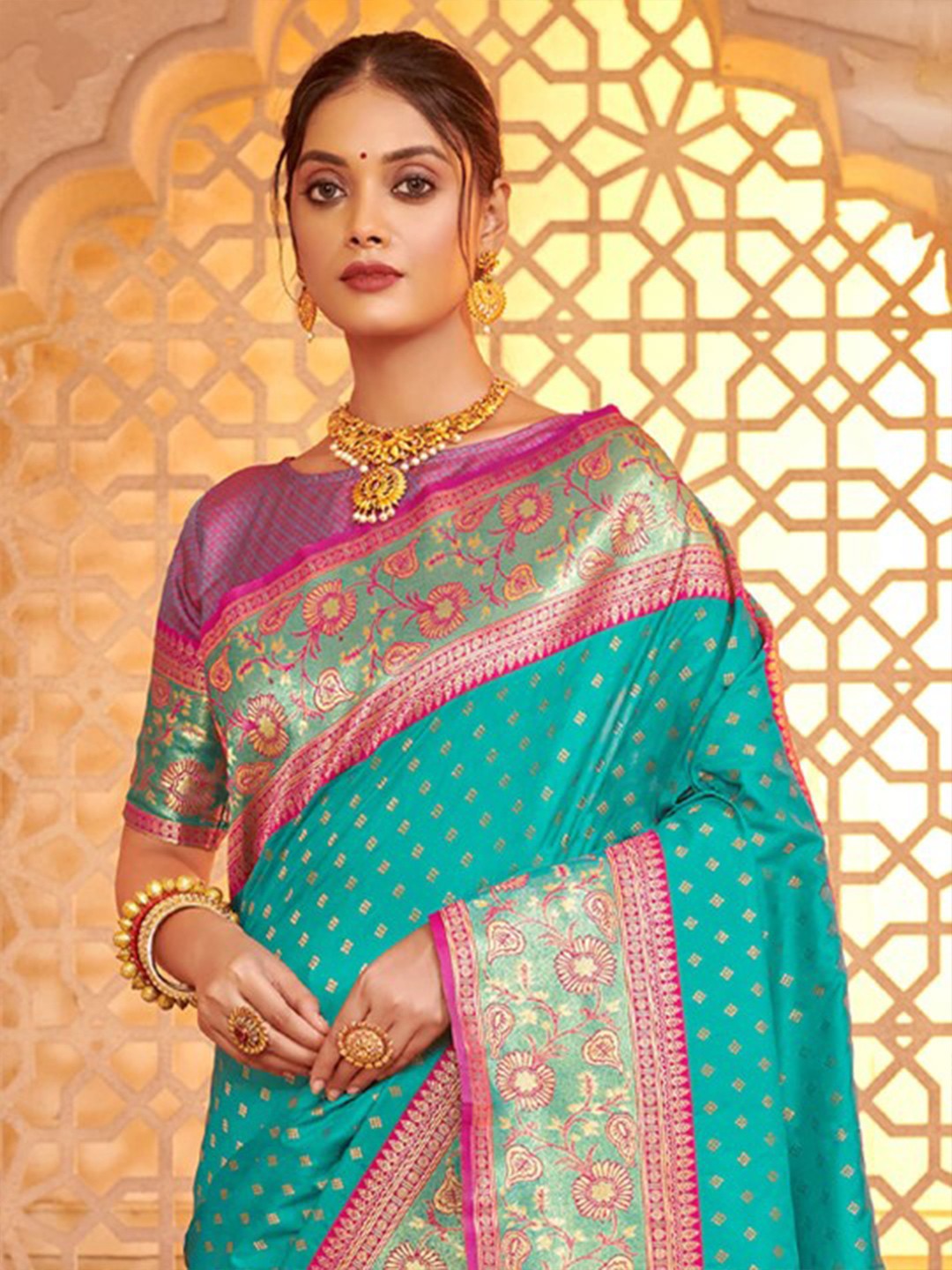 Tarani green silk saree upper body view with rich blouse and golden jewelry styling