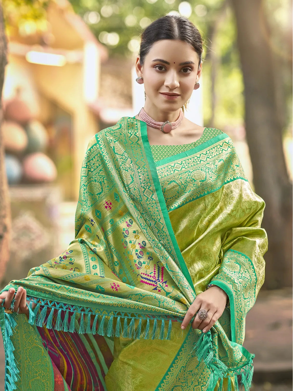 Tarani green Kanjivaram silk saree upper body view highlighting intricate woven blouse and pallu