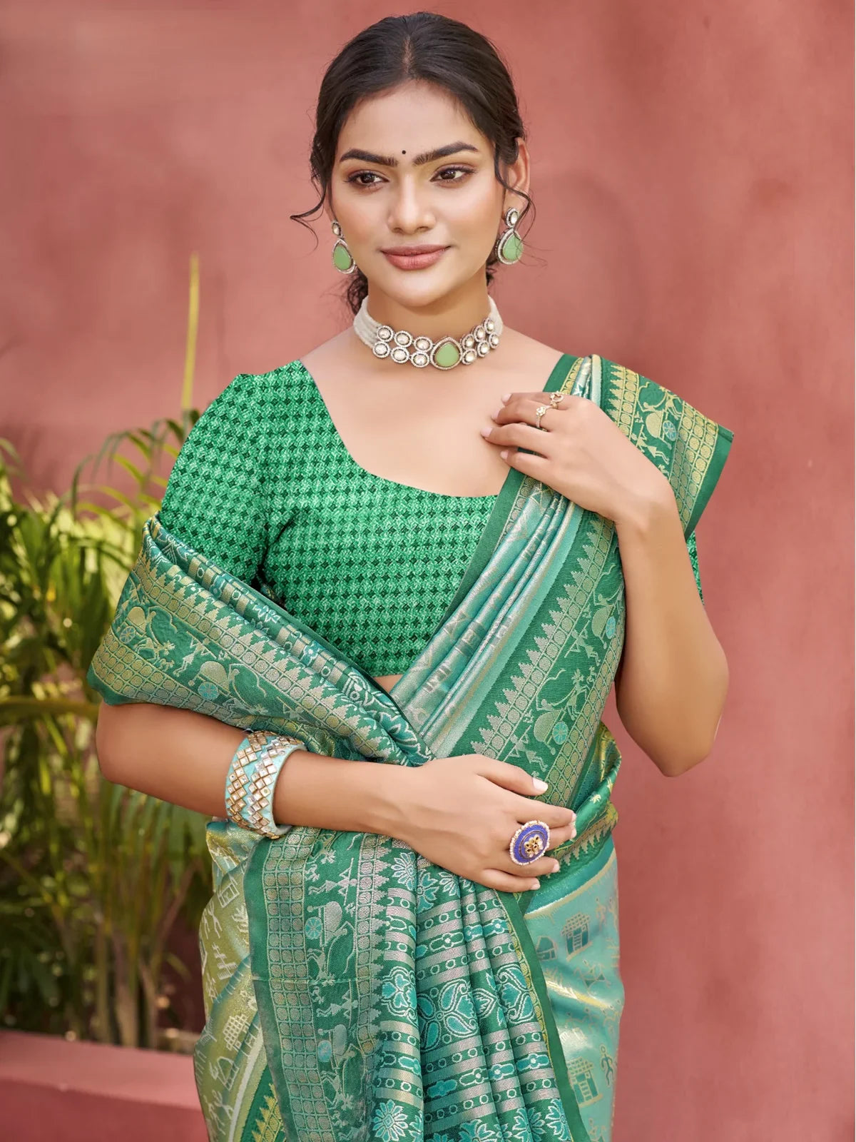 Tarani green kanjivaram silk saree close up upper body view with woven detailing and blouse