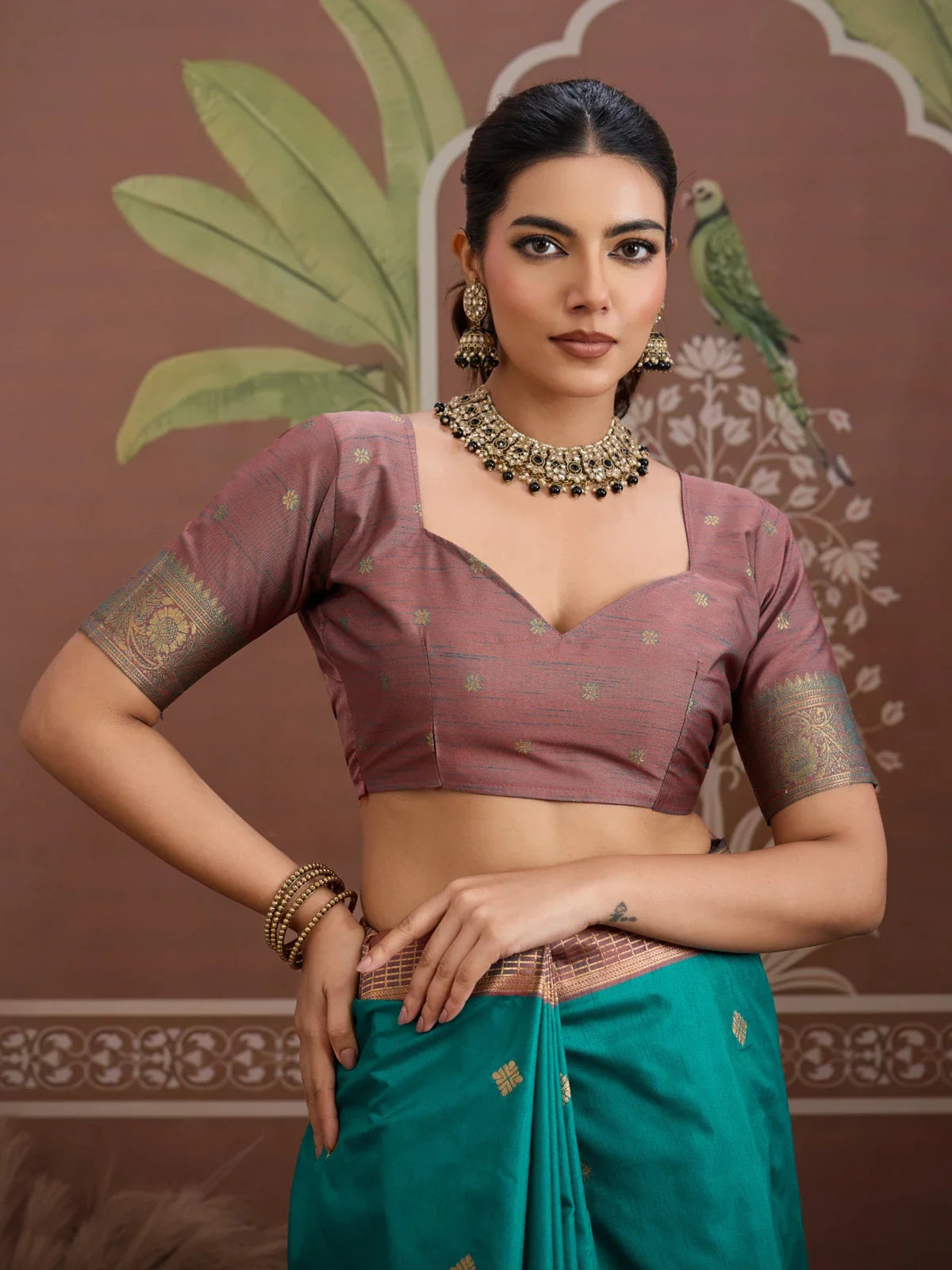 Tarani green silk saree with elegant brown blouse upper body view