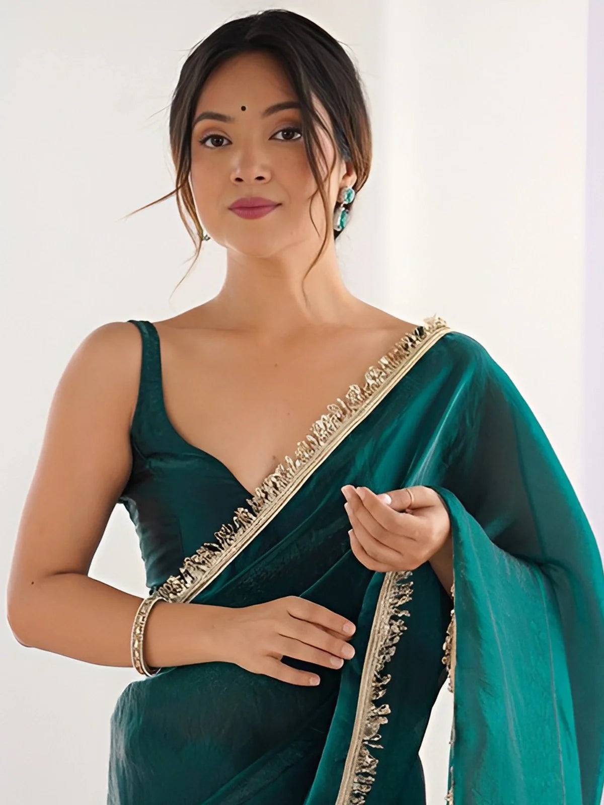 Tarani green silk saree with lace detail showing upper body view with elegant blouse