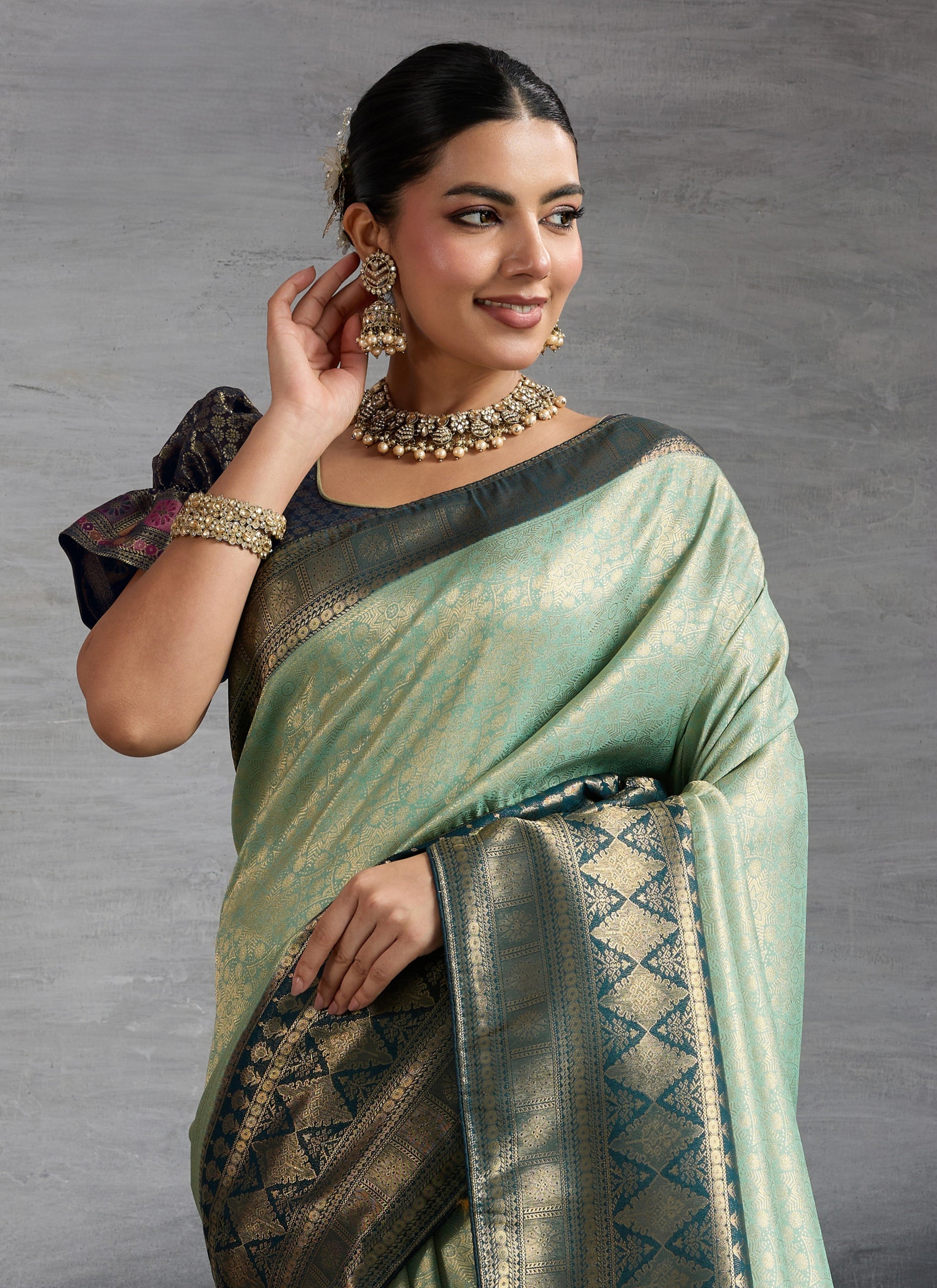 Tarani premium green Kanjivaram silk saree upper body closeup with blouse detail