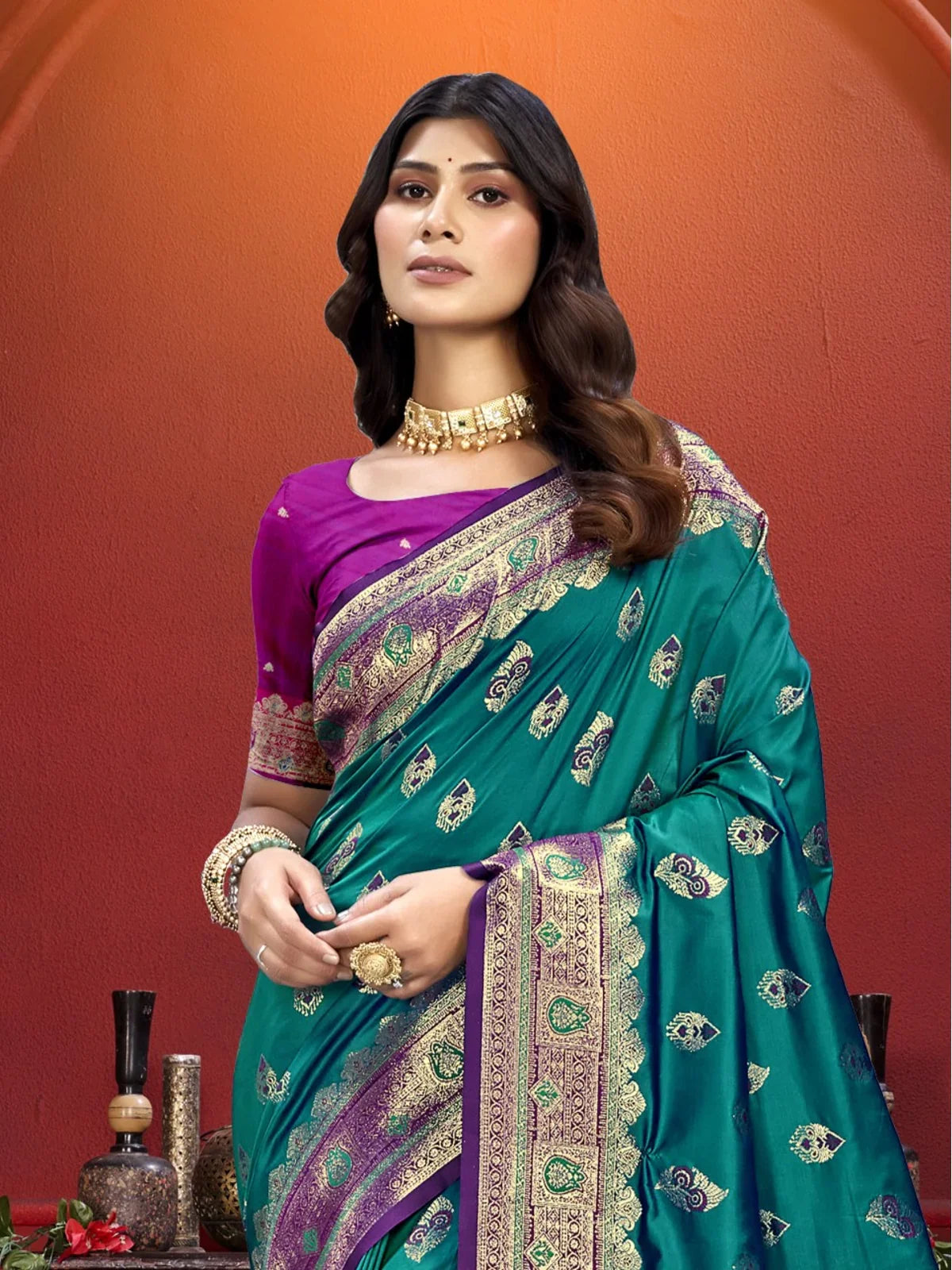 Tarani green silk saree close-up showing zari motifs and purple blouse design