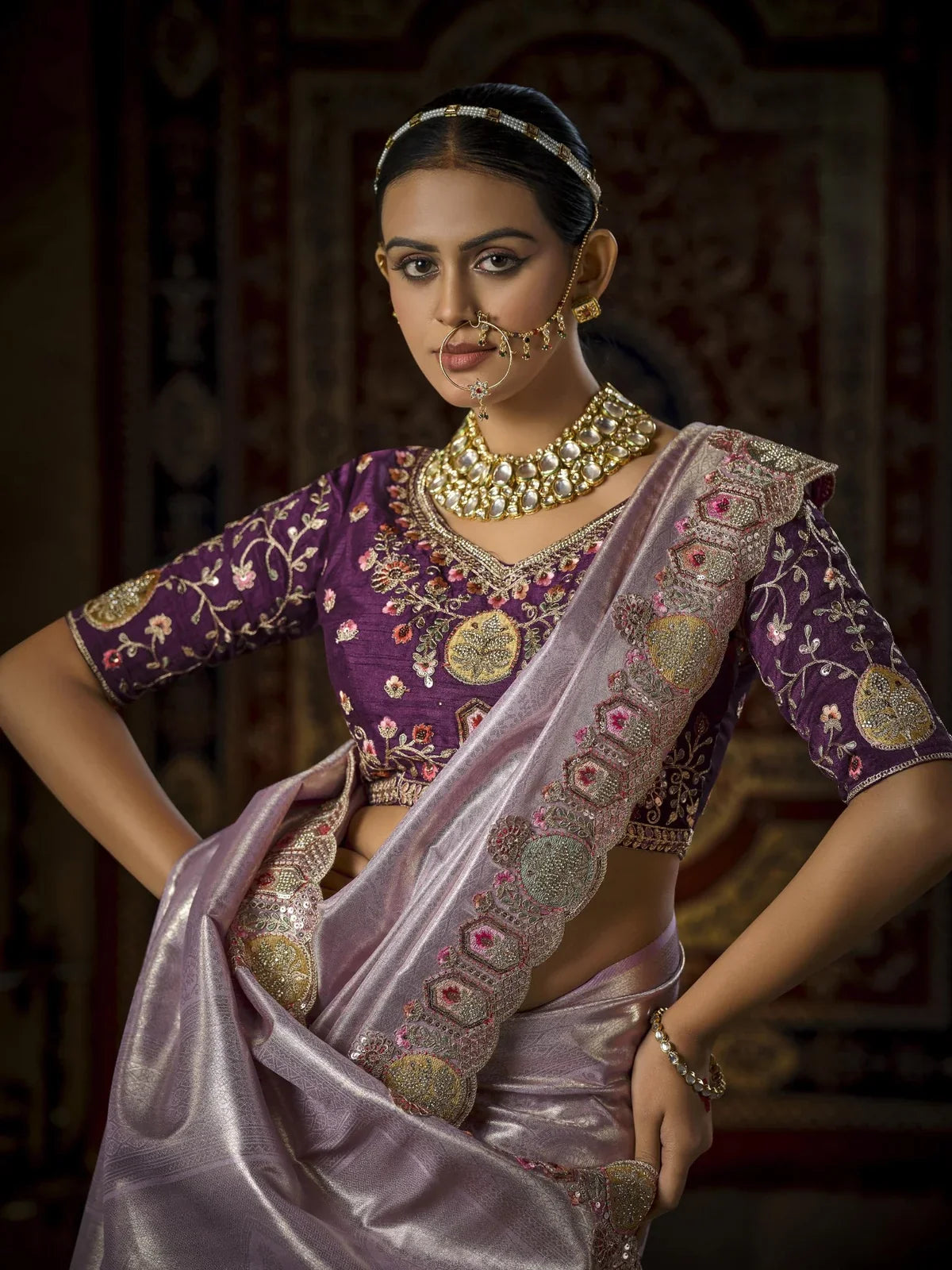Tarani close blouse view with heavy embroidery and hand work paired to lavender bridal saree