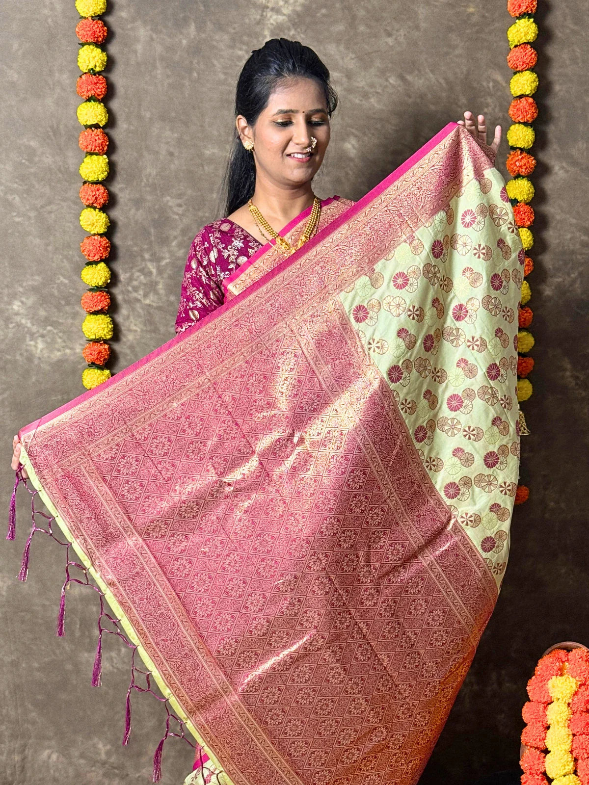 Tarani green silk saree detailed maroon pallu with golden zari design close view