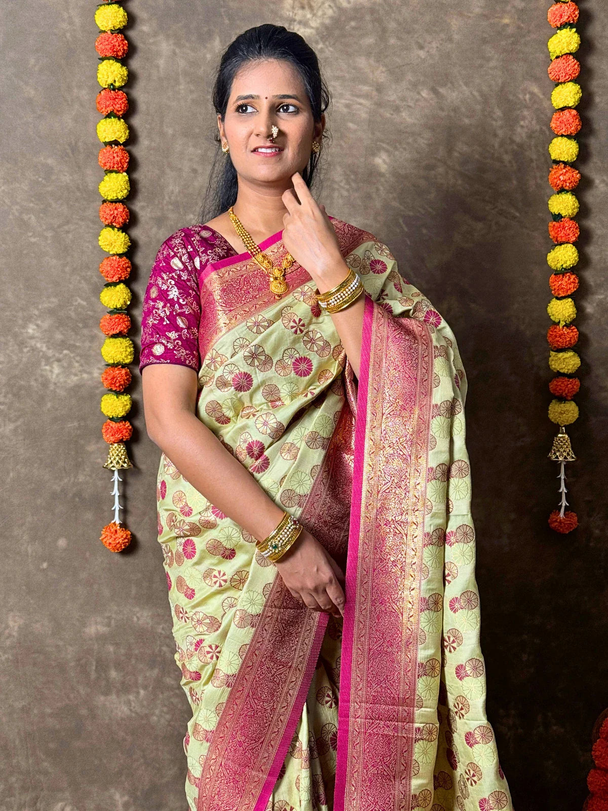 Tarani green silk saree upper body view styled with maroon blouse for traditional wear