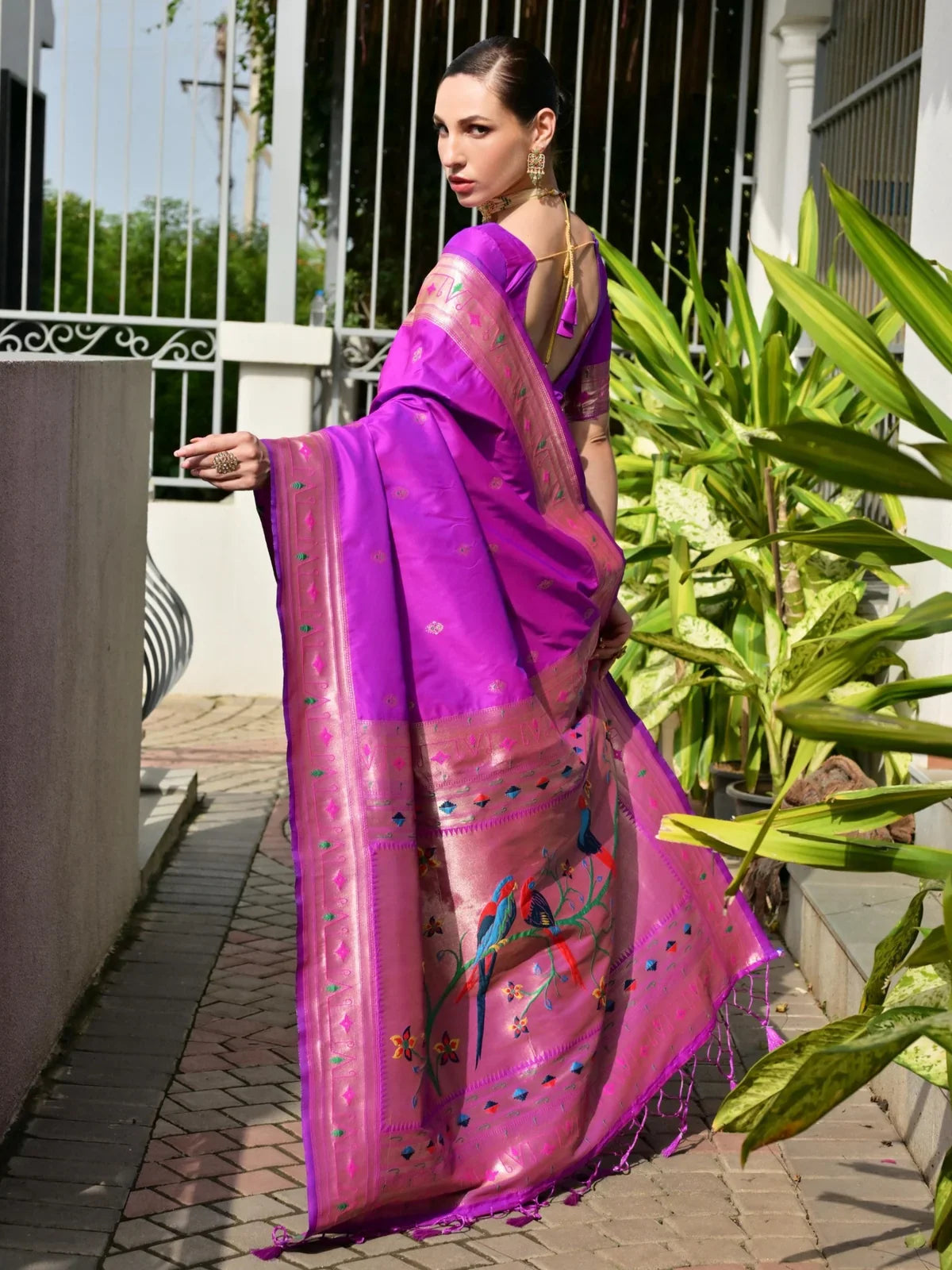 Tarani magenta silk saree back view highlighting border and graceful drape