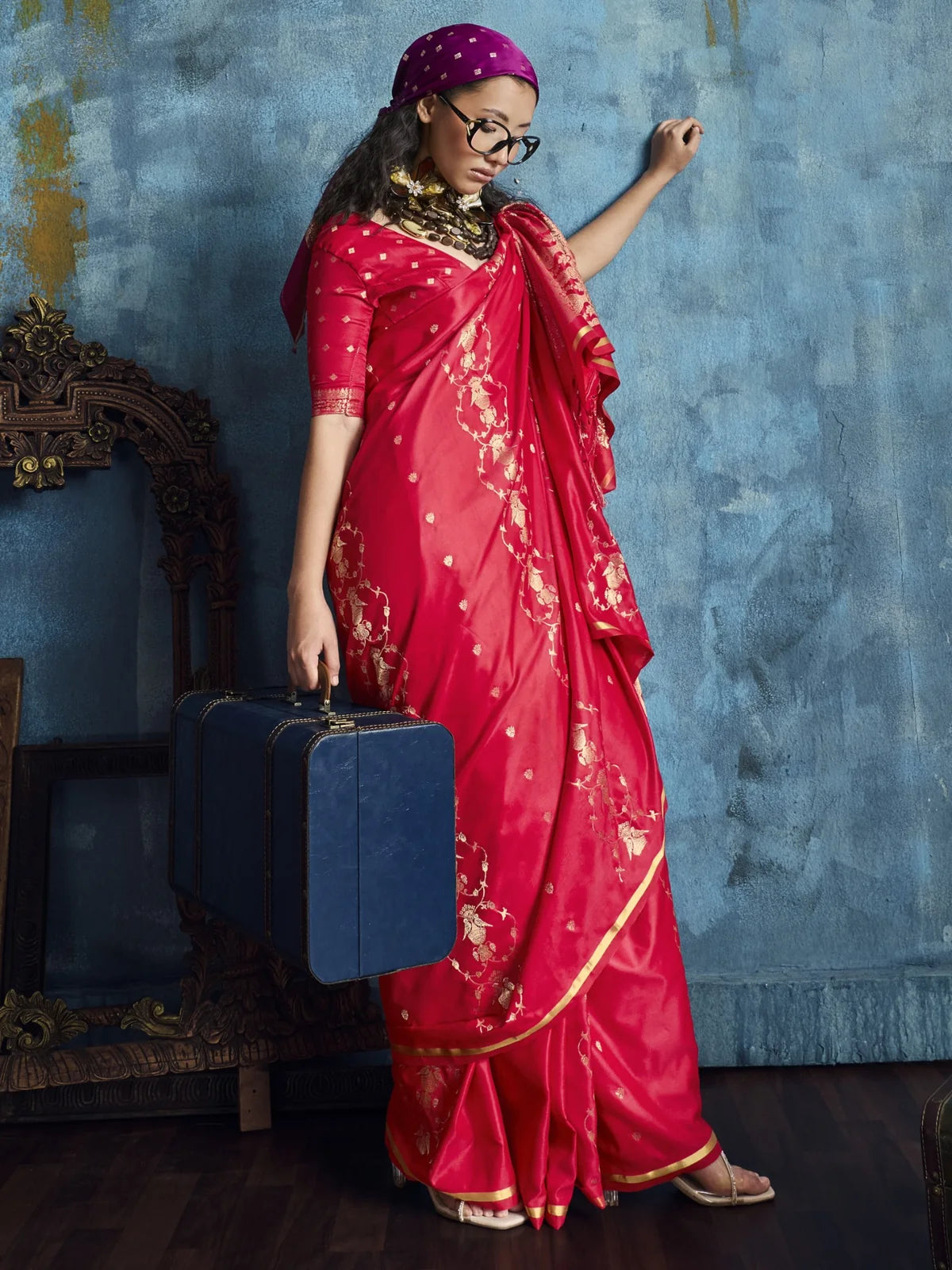 Tarani Aakasha magenta saree side view with graceful drape and woven floral handloom detailing