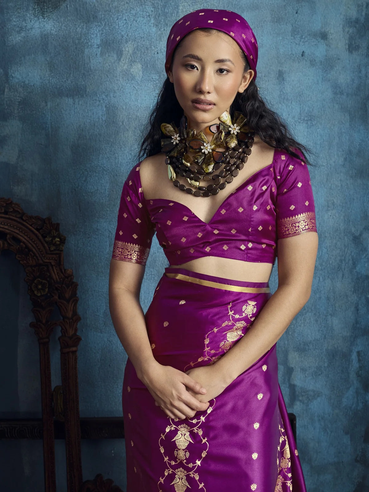 Tarani Nehal magenta satin handloom saree upper body view with brocade blouse and zari motifs