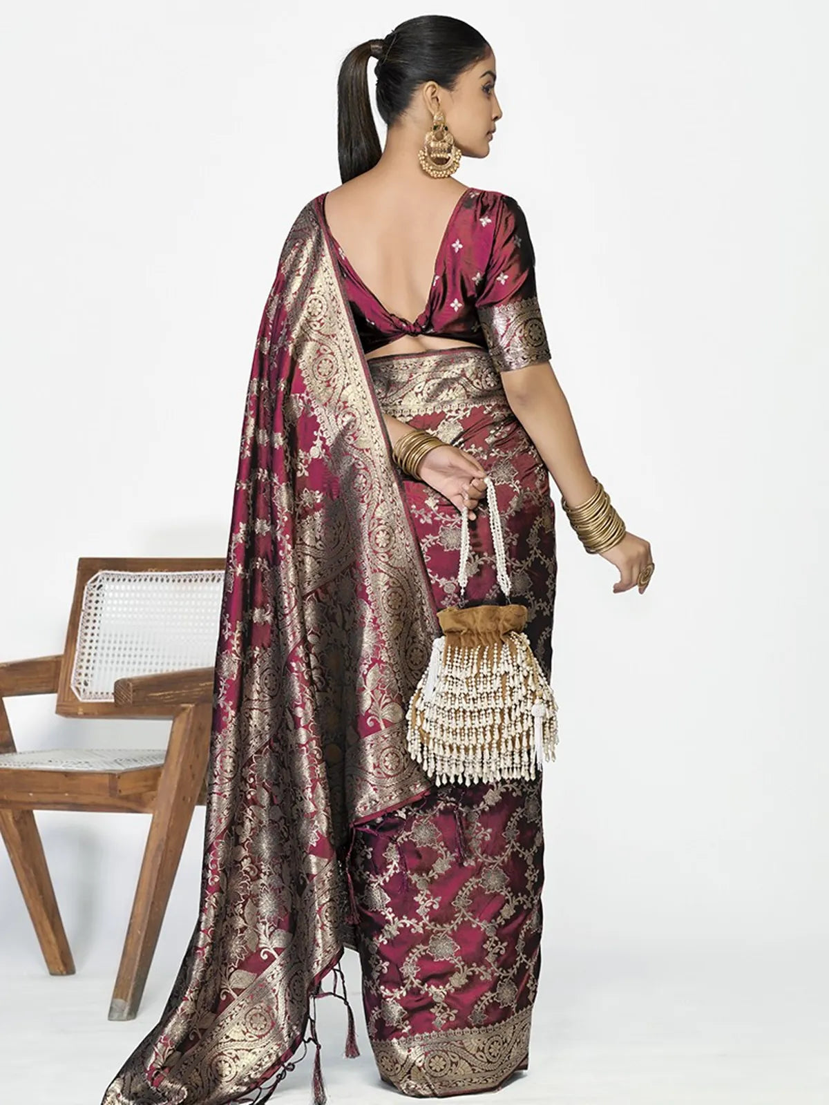 Tarani maroon silk saree full back view with blouse knot and drape