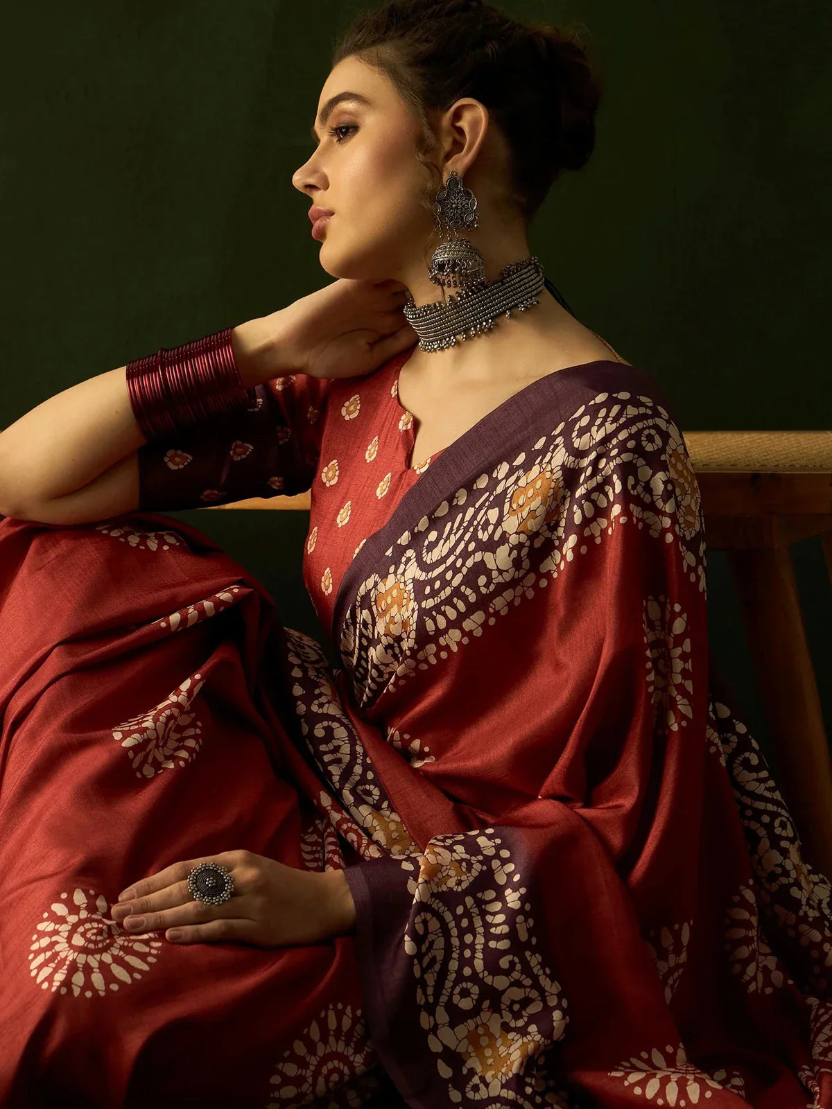 Tarani maroon silk saree close-up view showing ethnic motif details