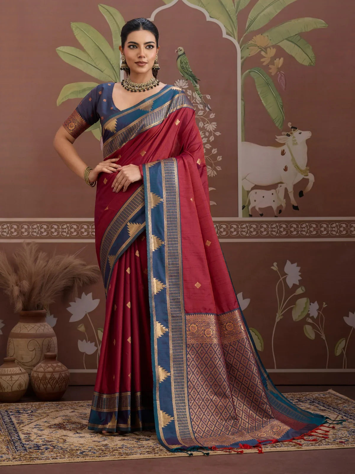 Tarani maroon silk saree with golden motifs and contrast blue pallu full view