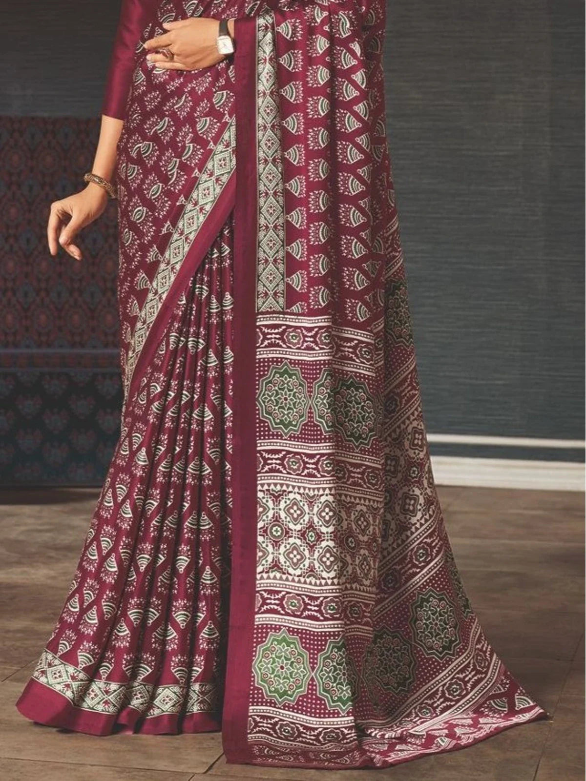 Tarani maroon silk saree pallu view with detailed border and traditional motifs