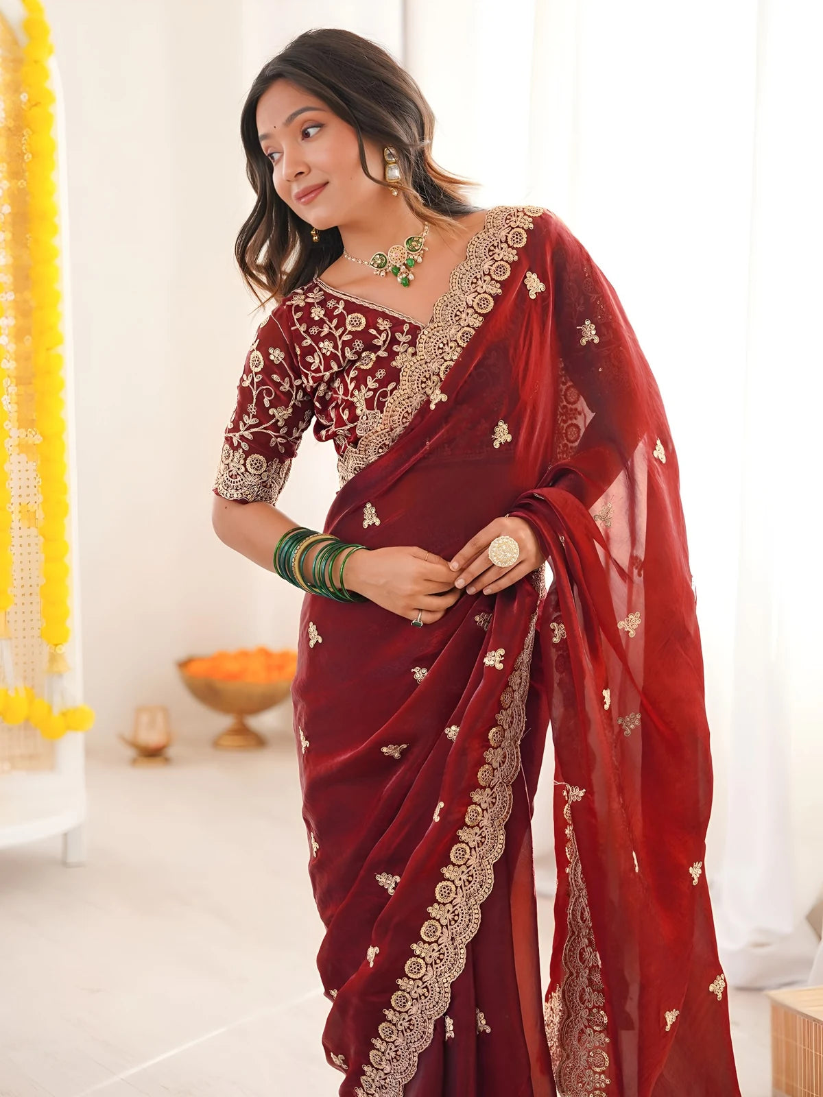 Tarani Mrunmayi maroon saree upper body view with embroidered blouse and elegant border