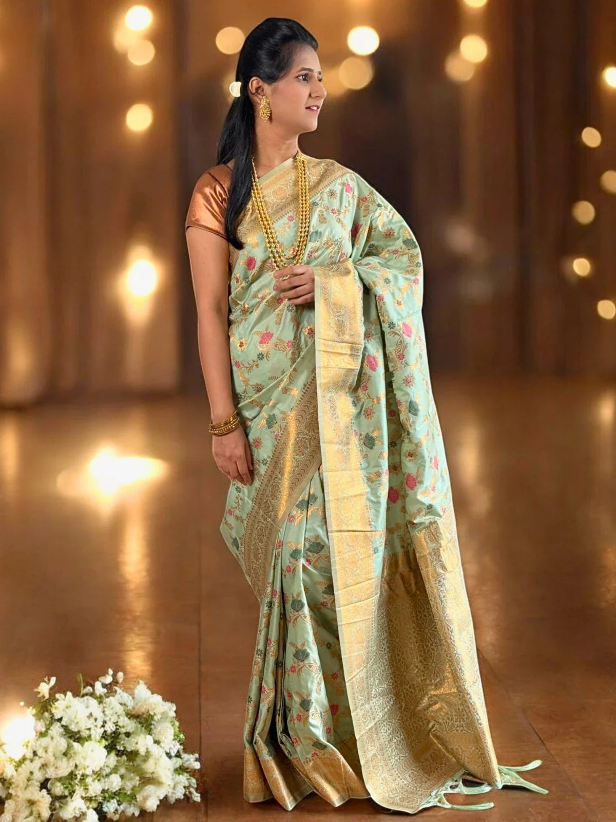 Tarani graceful green silk saree side view with rich woven detailing