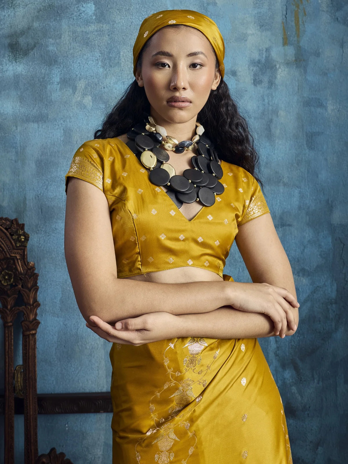 Tarani Nishika mustard pure satin saree upper body view showcasing woven blouse and neckline