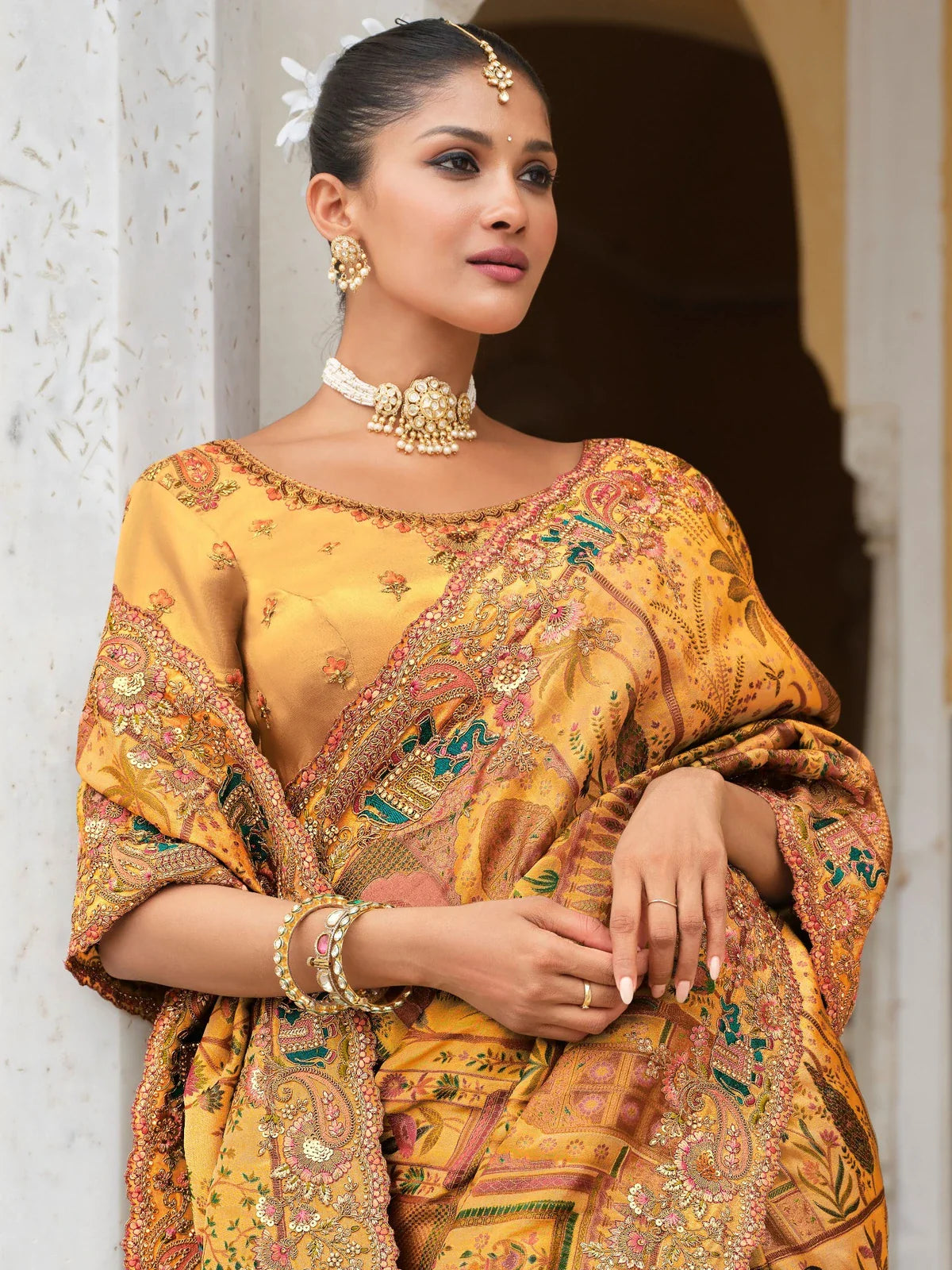 Tarani mustard silk saree upper body view showing detailed zari blouse and traditional styling for festive occasions