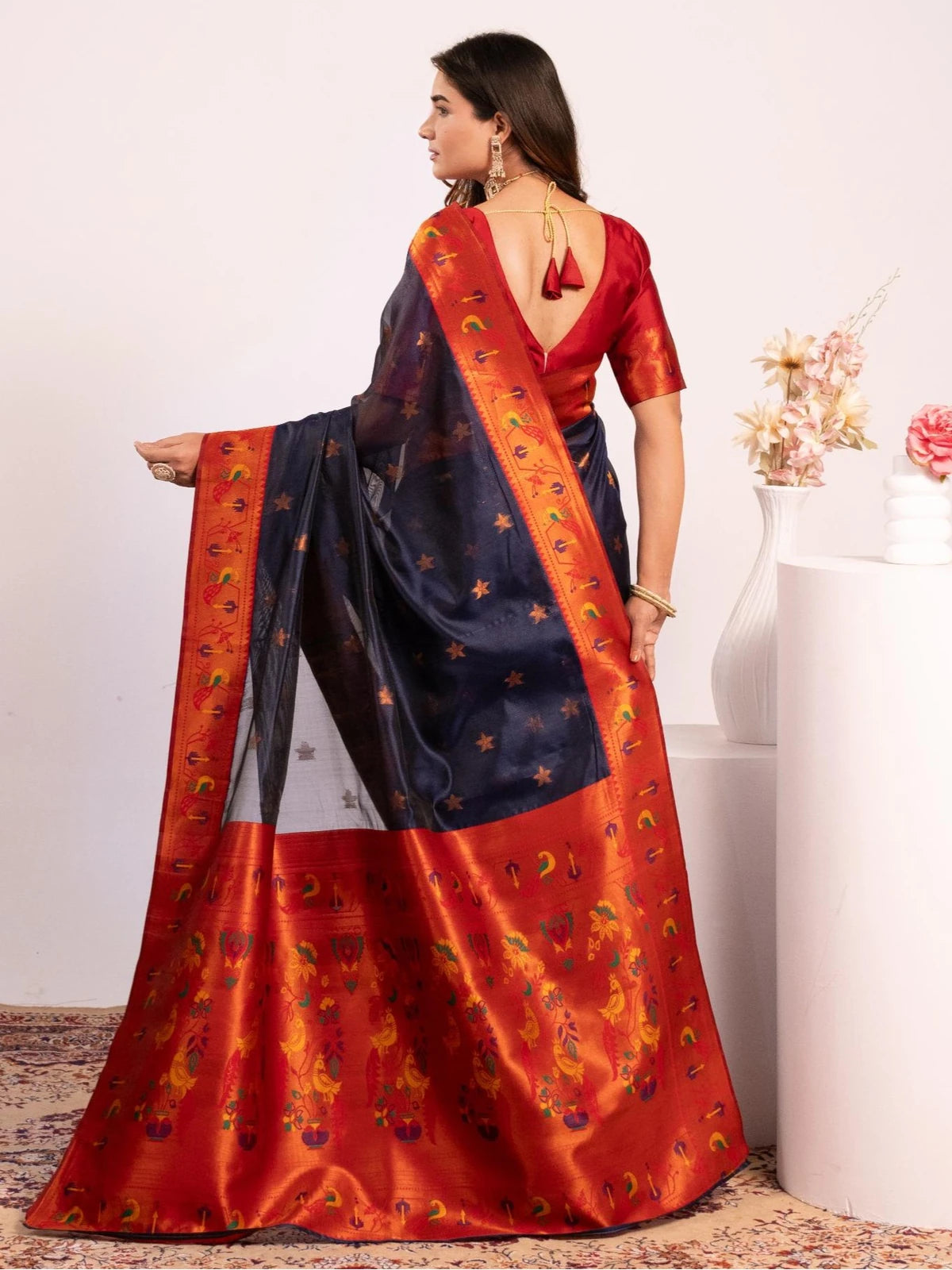 Tarani navy blue Paithani saree back view with contrast blouse