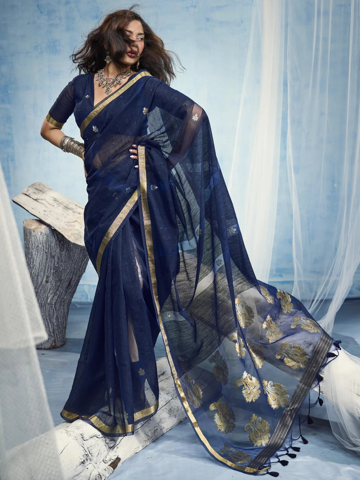 Tarani navy blue saree side view highlighting drape and pallu