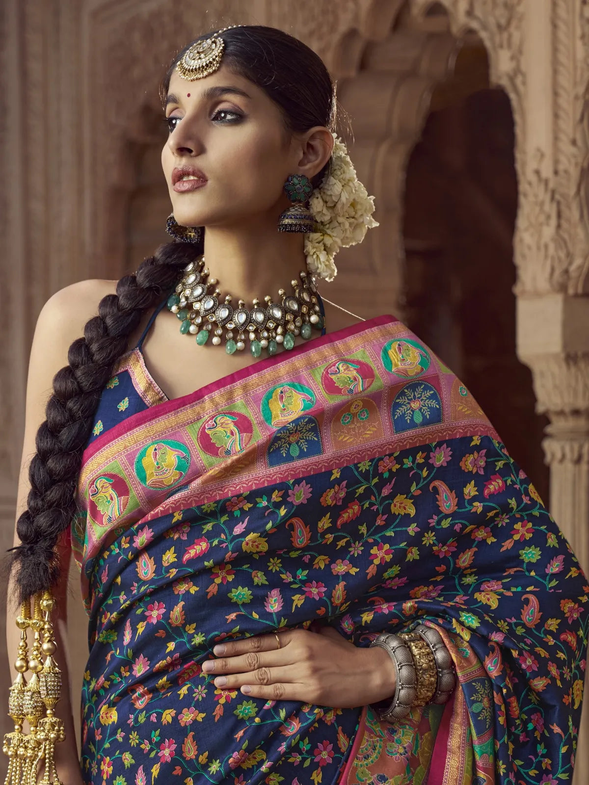 Tarani premium blue silk saree upper body view with pink border and elegant jewellery