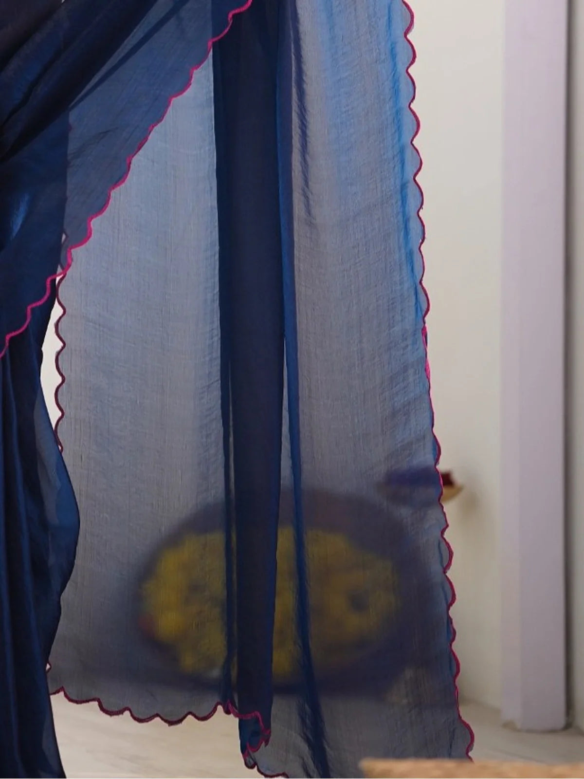 Tarani premium navy blue soft space silk saree pallu view showing pink border and flowing fabric texture