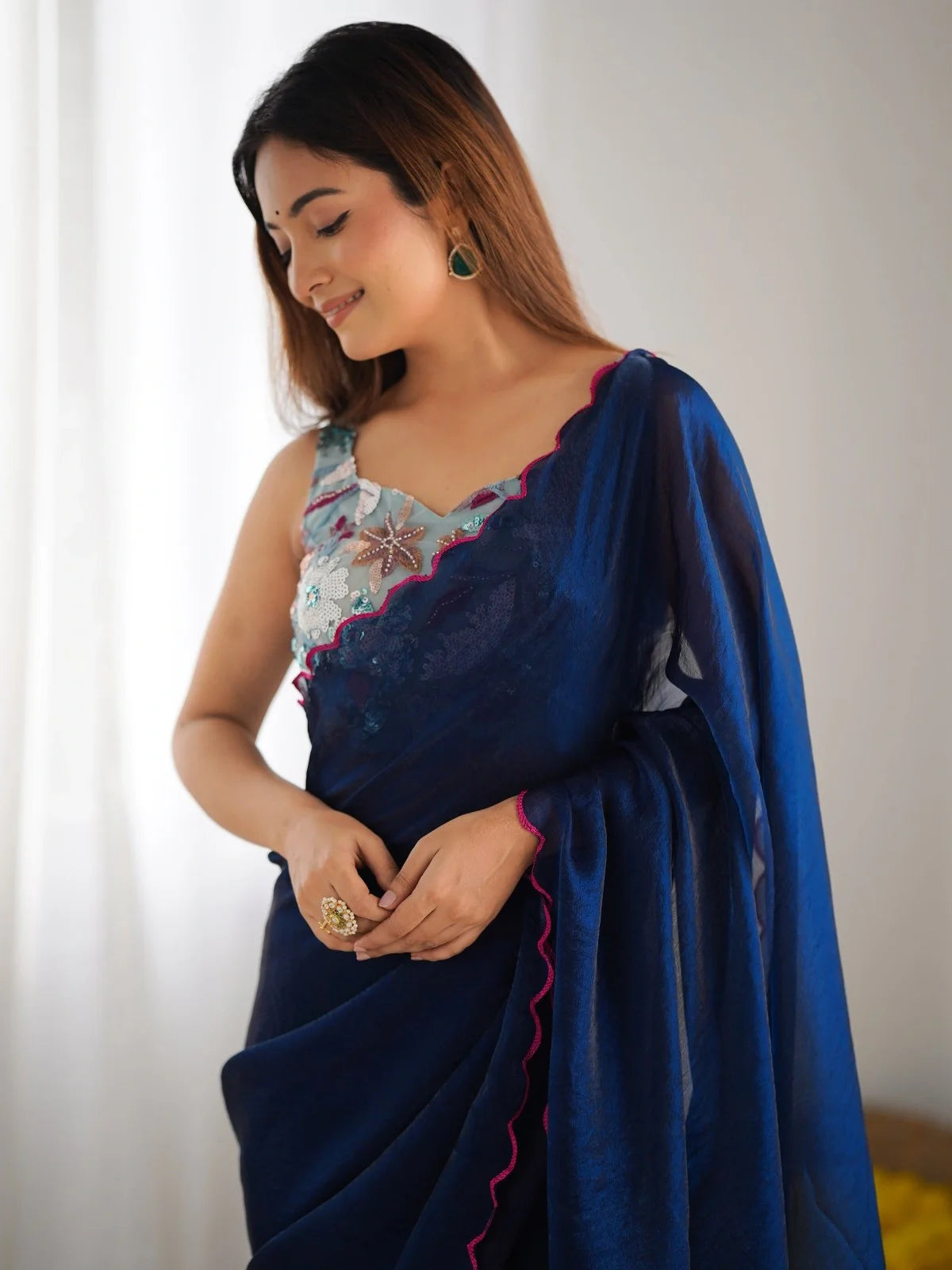 Tarani navy blue saree close up with scallop border and embroidered designer blouse in silver and blue
