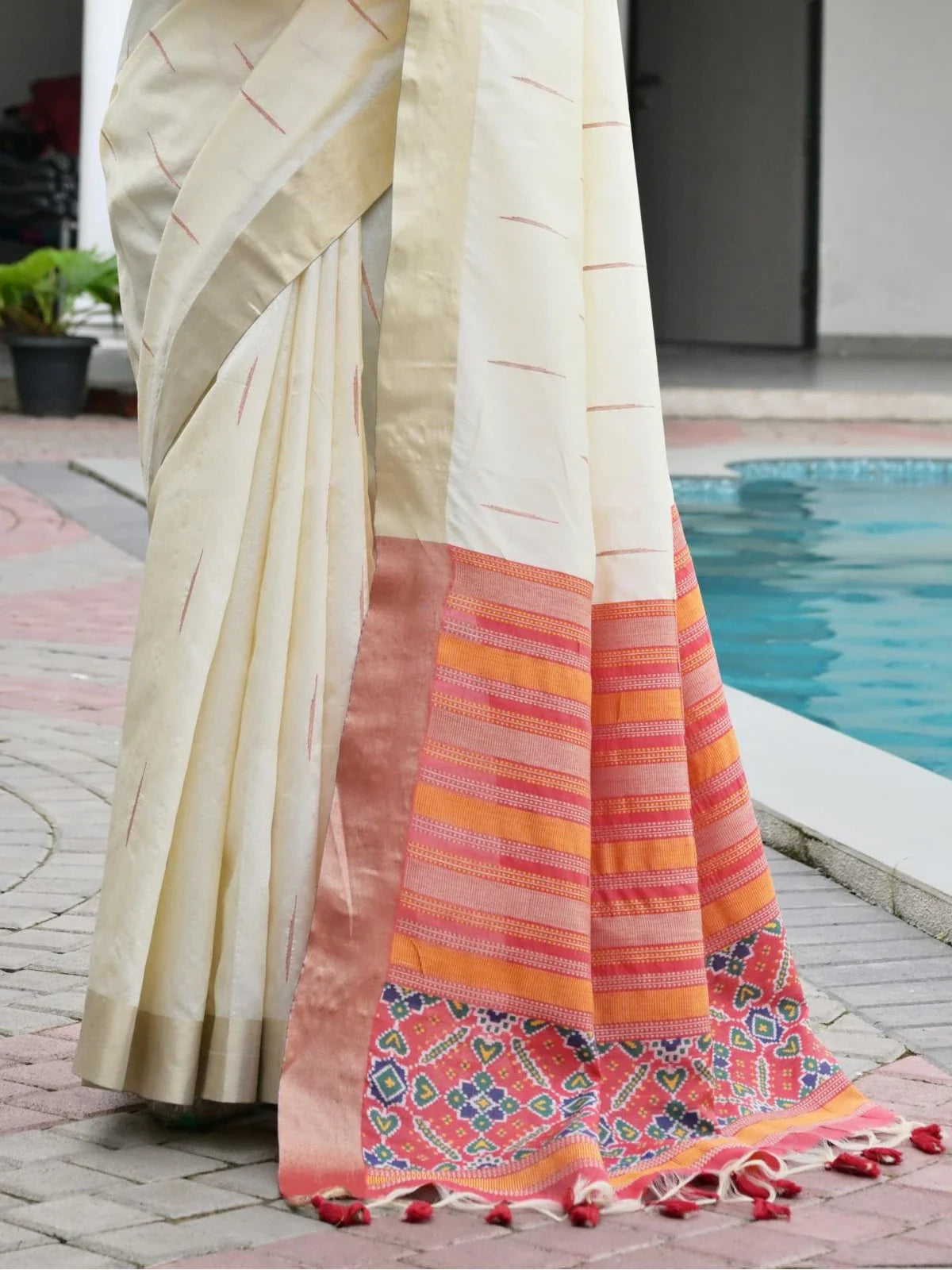 Tarani premium off white saree pallu with traditional border and red ikkat detailing