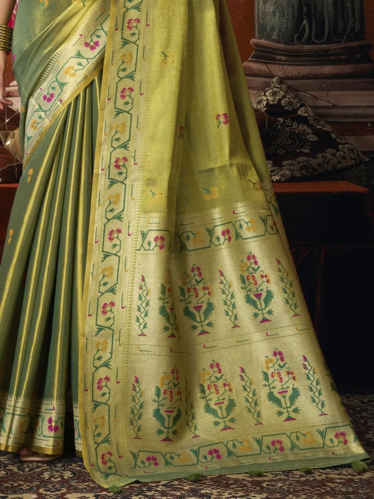 Tarani olive green tissue silk Paithani pallu close view with floral woven border and tassels