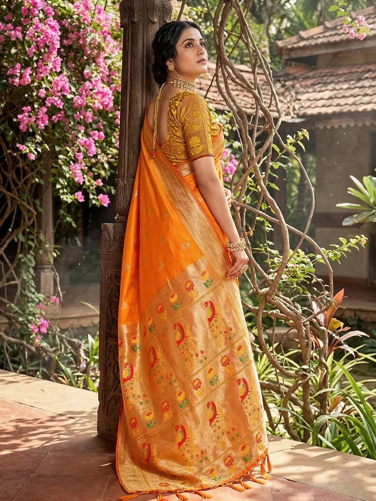 Tarani Minal orange soft silk saree back view highlighting woven pallu design