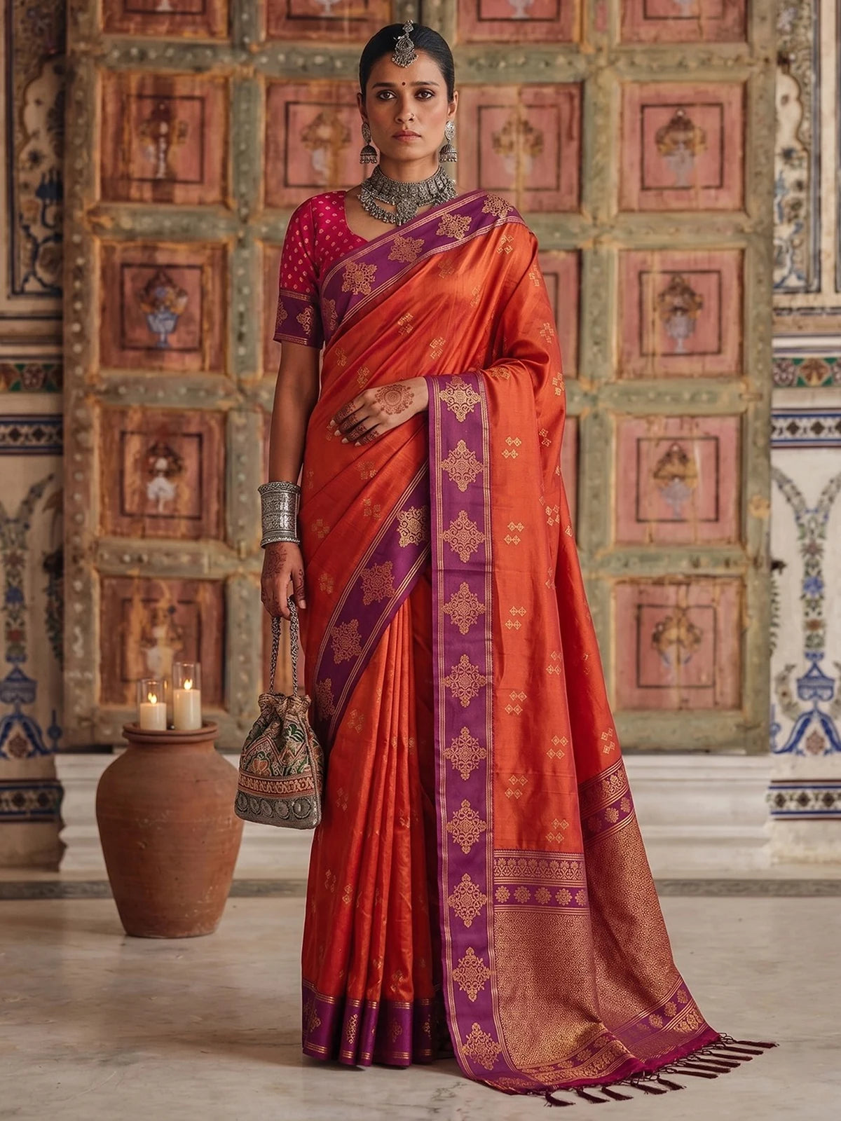 Tarani premium soft silk orange saree with purple woven border full view