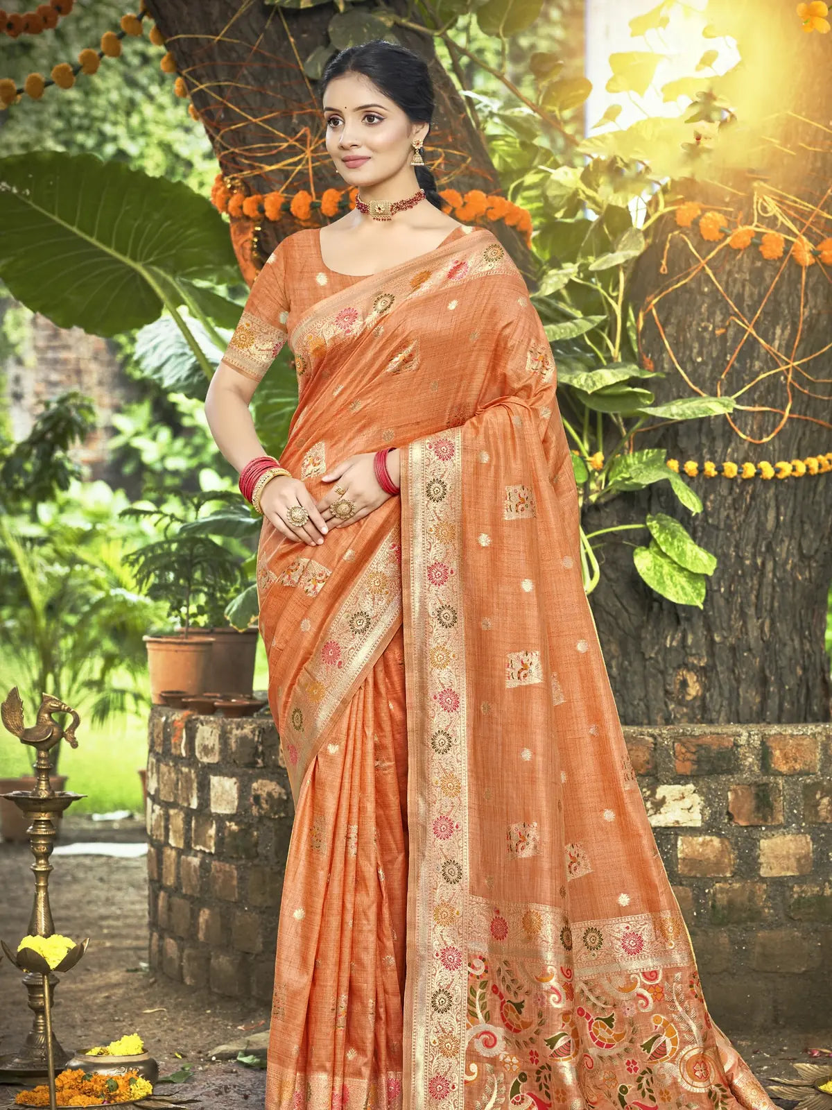 Tarani Kimiyavitika orange silk saree full view with zari border and floral pallu, matching blouse piece, festive traditional