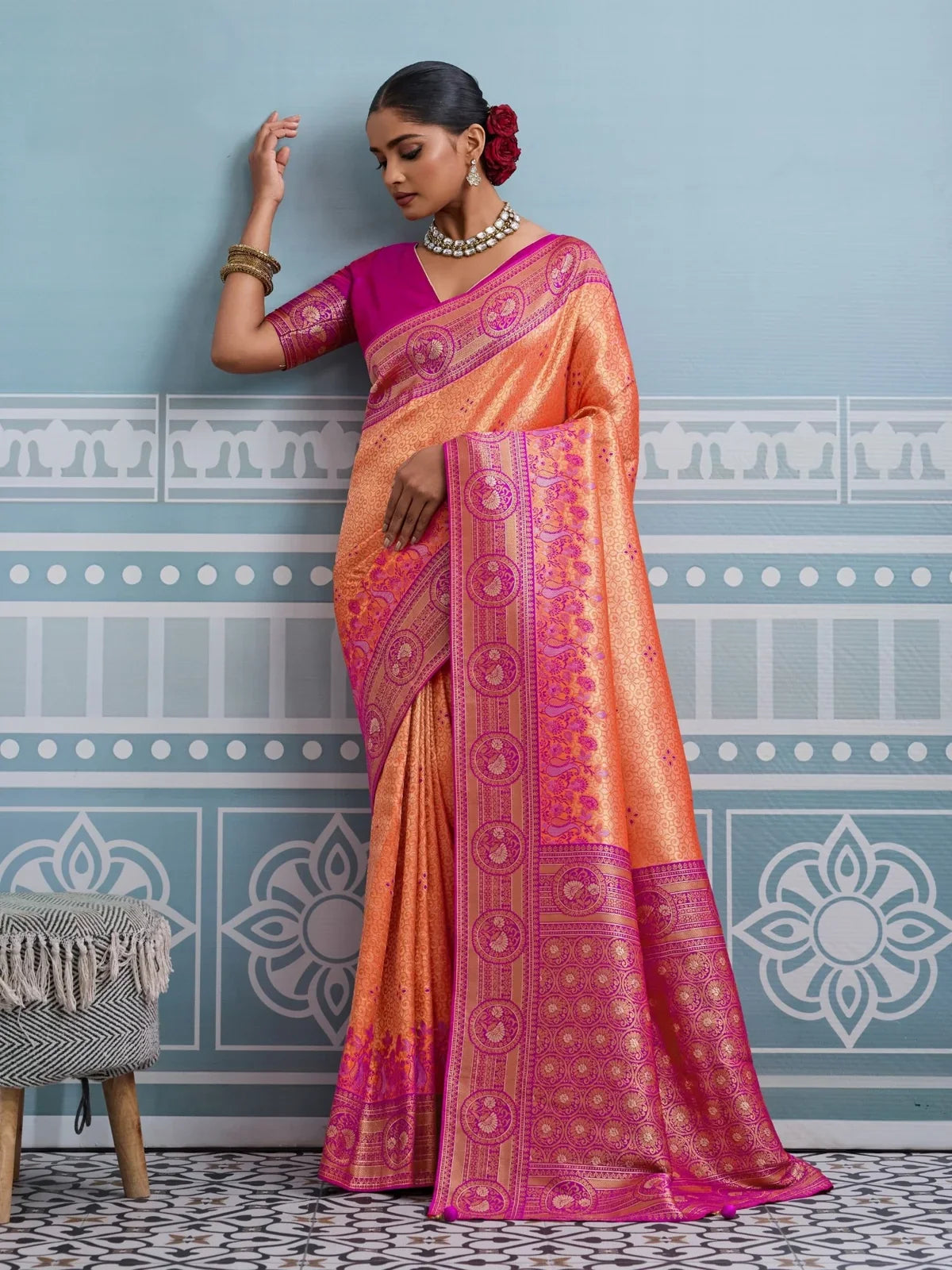 Tarani premium orange silk saree with rich zari weaving and broad pallu full view