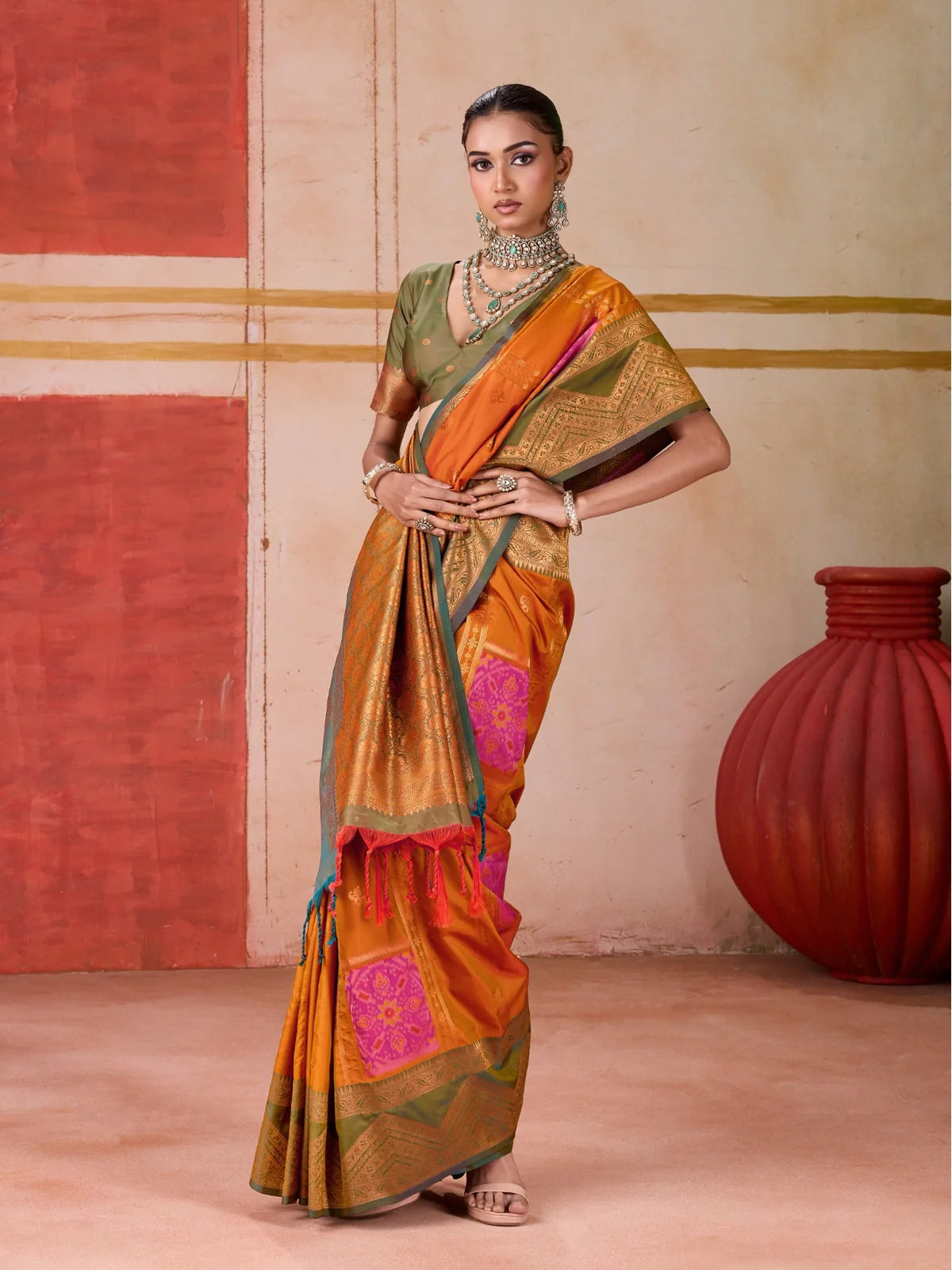 Tarani premium orange handloom silk saree with traditional green blouse front full view
