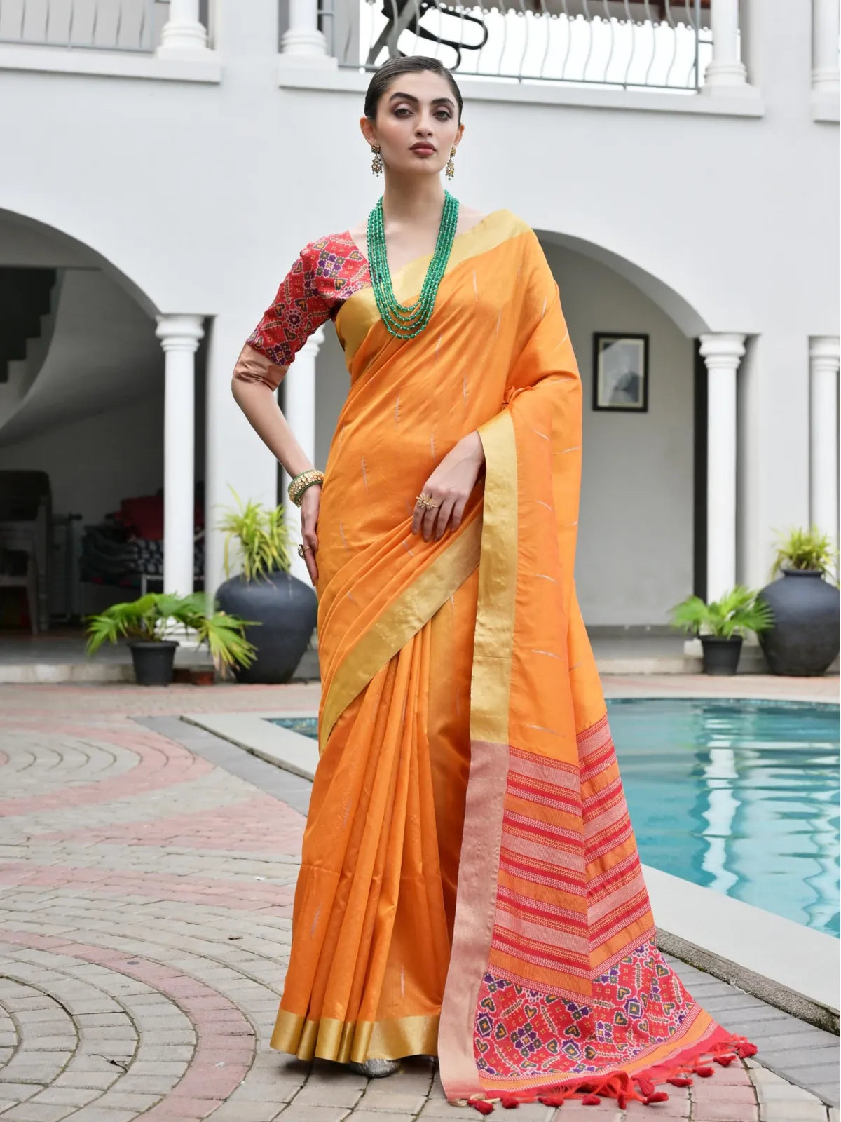 Tarani orange silk saree with ikkat weaving and zari border full view worn by model