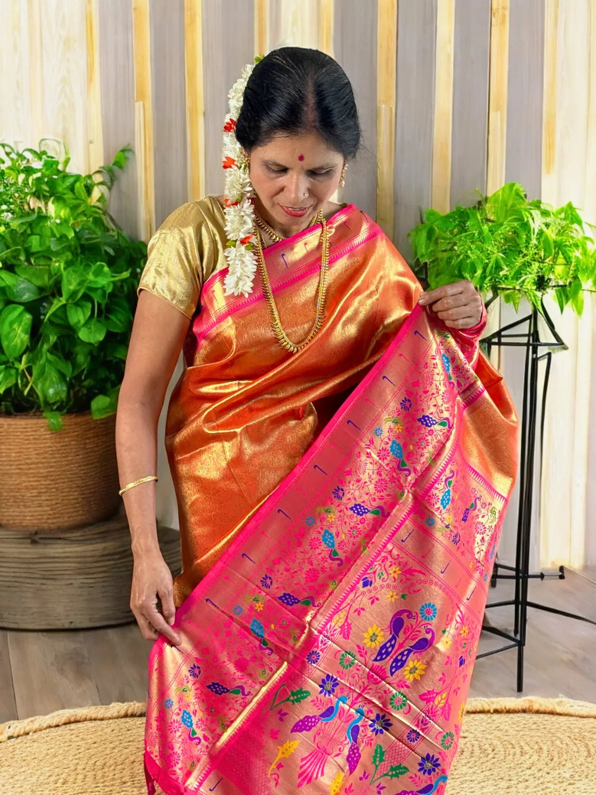 Tarani orange silk saree with detailed pink pallu woven design and motifs