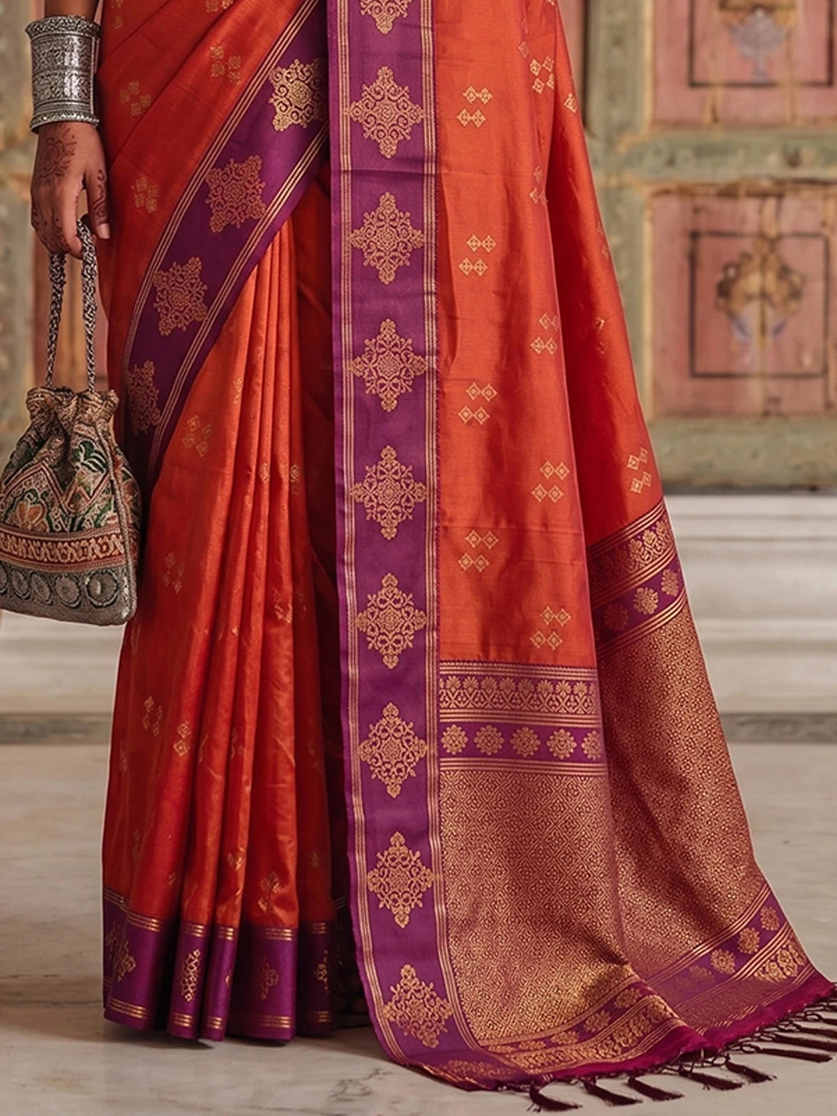 Tarani premium soft silk orange saree with purple woven border pallu view