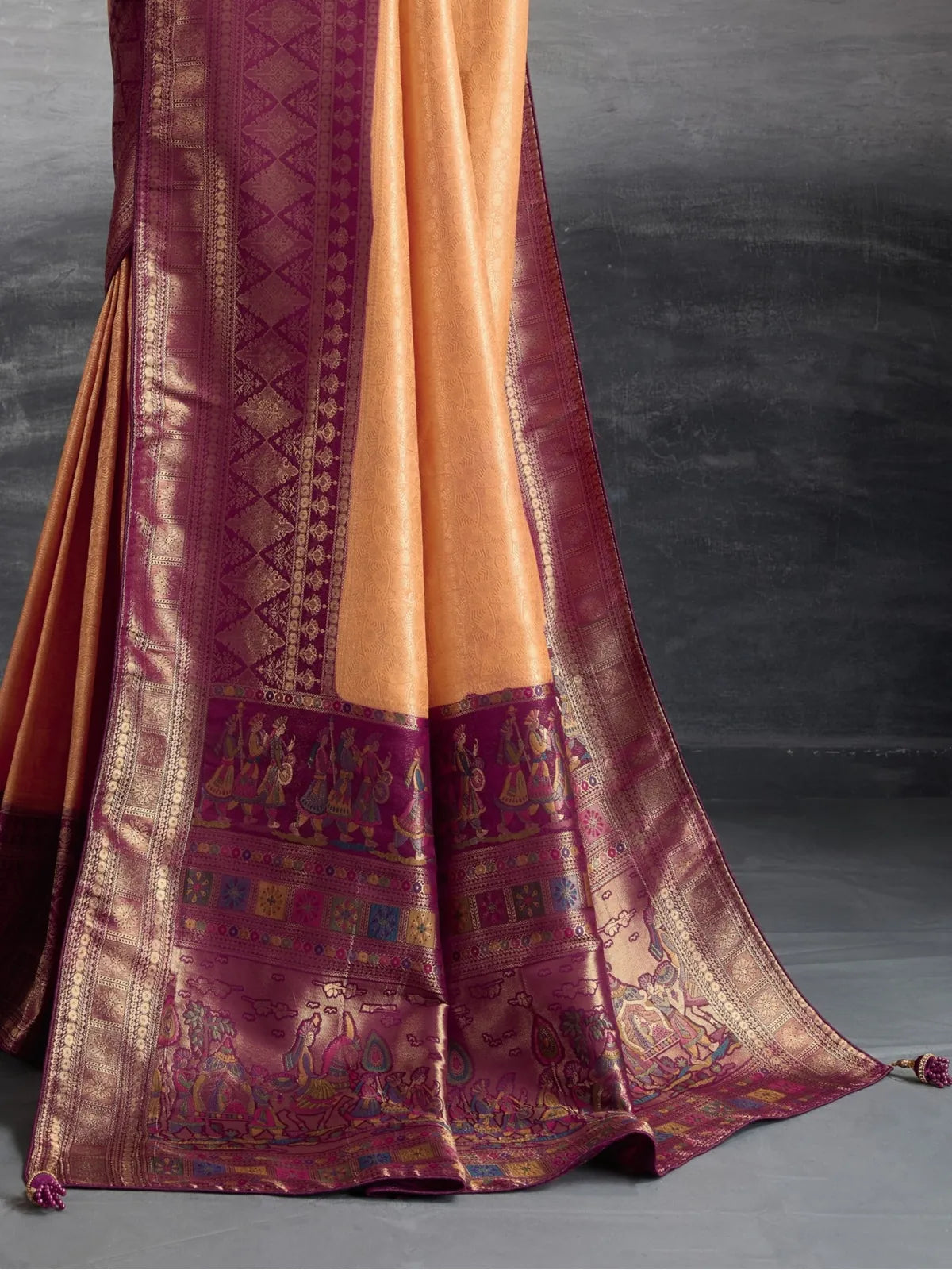 Tarani orange silk saree pallu closeup with detailed meenakari wedding theme weaving