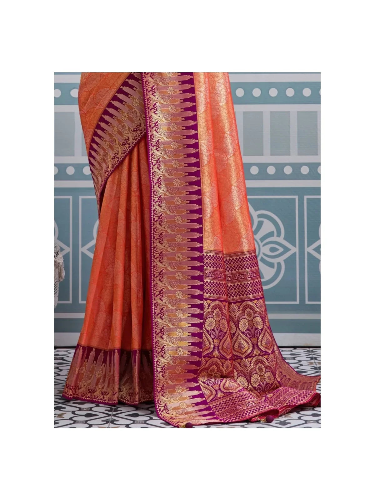 Tarani orange silk saree pallu view highlighting meenakari weaving and border