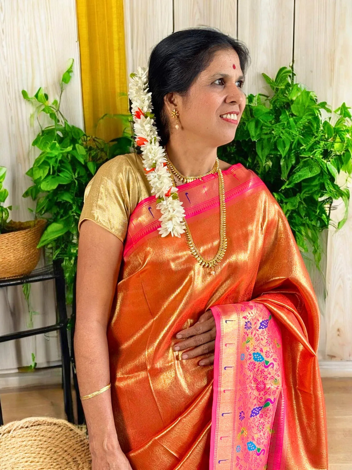 Tarani orange silk saree upper body view with zari border and matching blouse