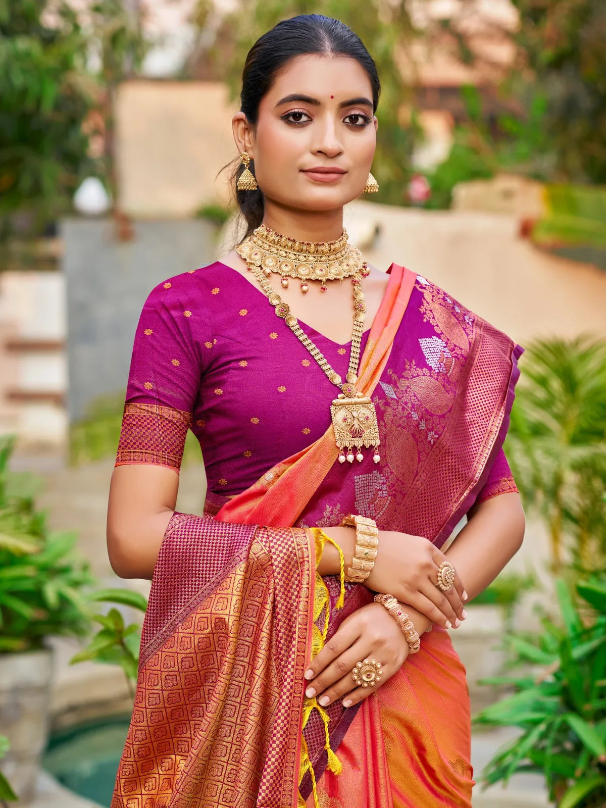 Tarani orange soft silk saree upper body view with contrast blouse and zari woven detailing