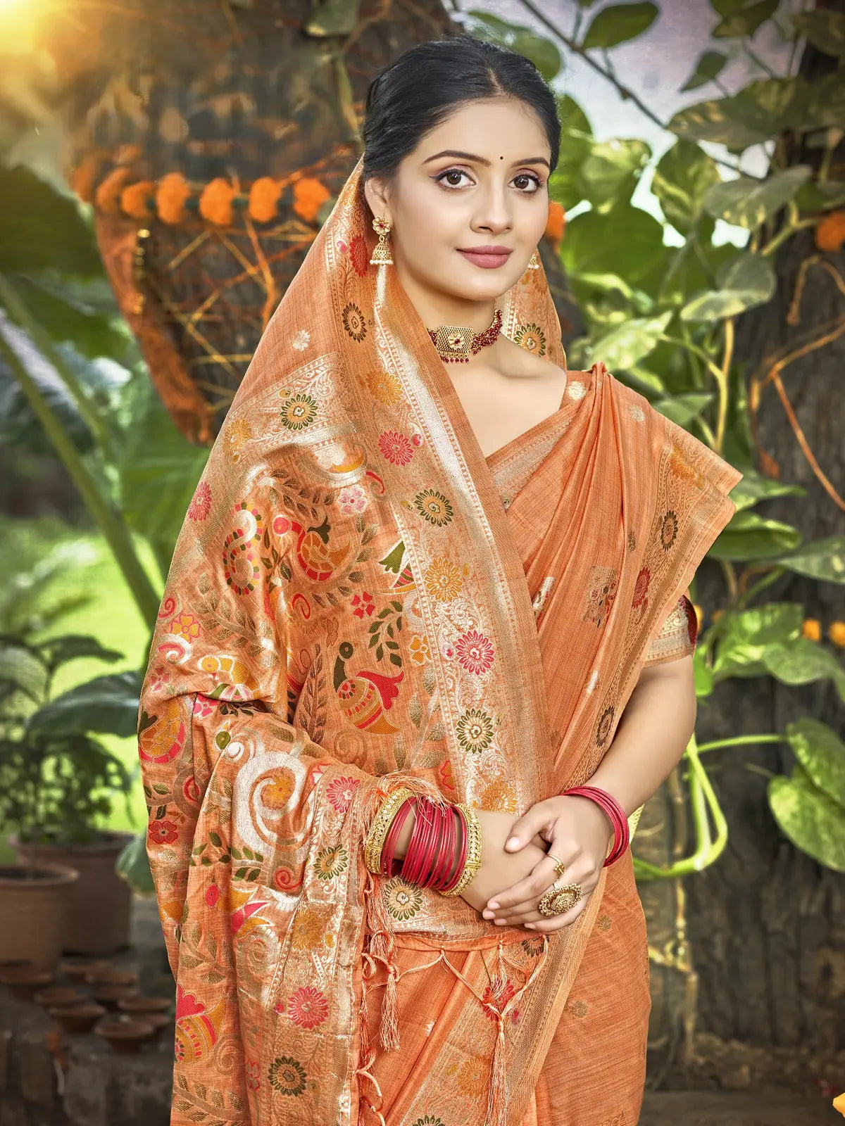 Tarani Kimiyavitika orange silk saree upper body view with pallu drape, delicate zari motifs, elegant festive style