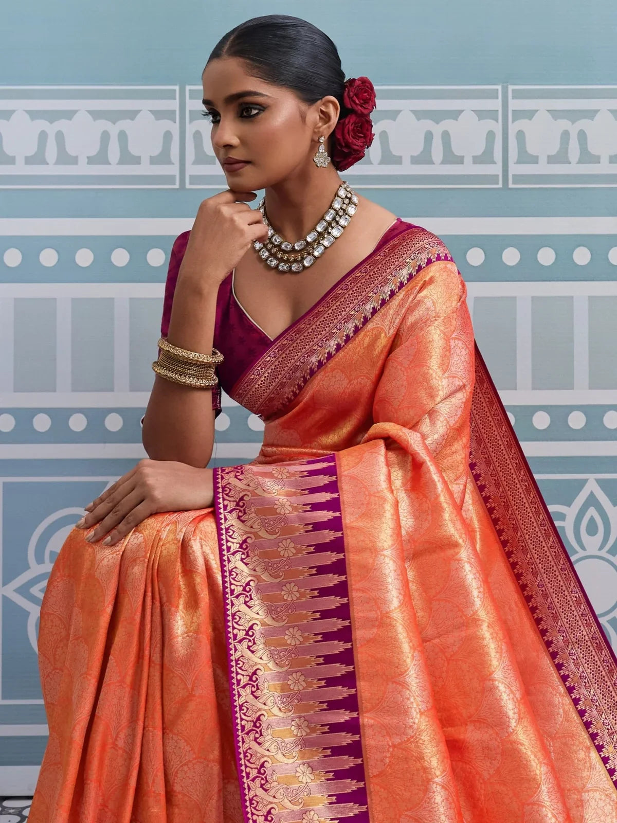 Tarani orange silk saree upper body view styled with self woven blouse