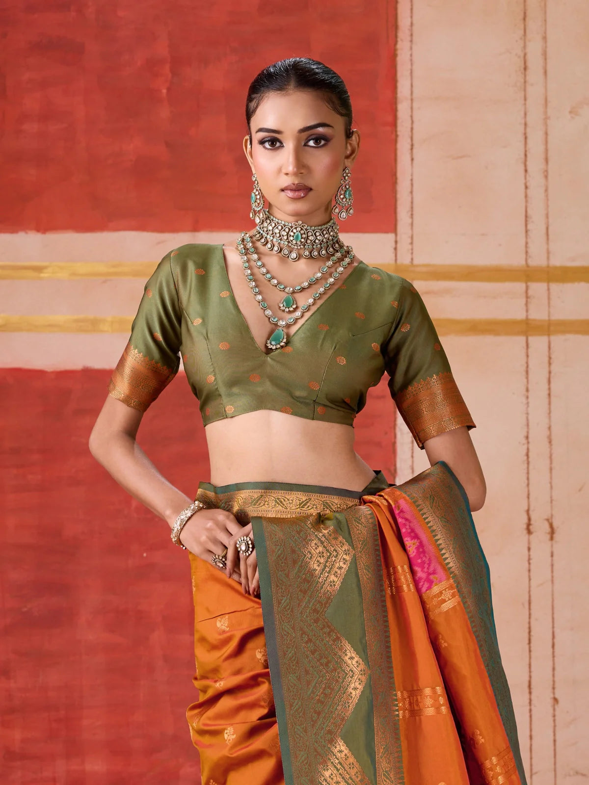 Tarani rich orange silk saree with green silk blouse close-up of upper body with necklace styling